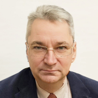 Photo of the institution's director - a man in a suit, a white shirt with a slipper, glasses on his eyes